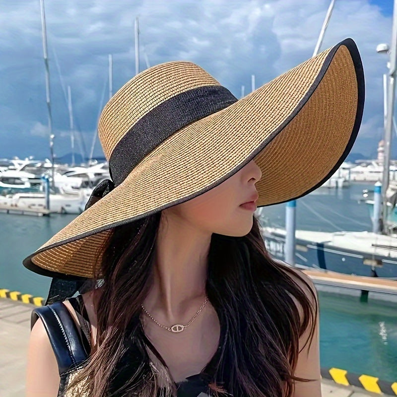 A Women'S Summer Straw Hat Designed for Outdoor Use, Featuring a Wide Beach Strap. It'S Foldable, Lightweight, And Easy to Carry, Making It Perfect for Holidays And Outdoor Events, As Well As a Stylish Accessory